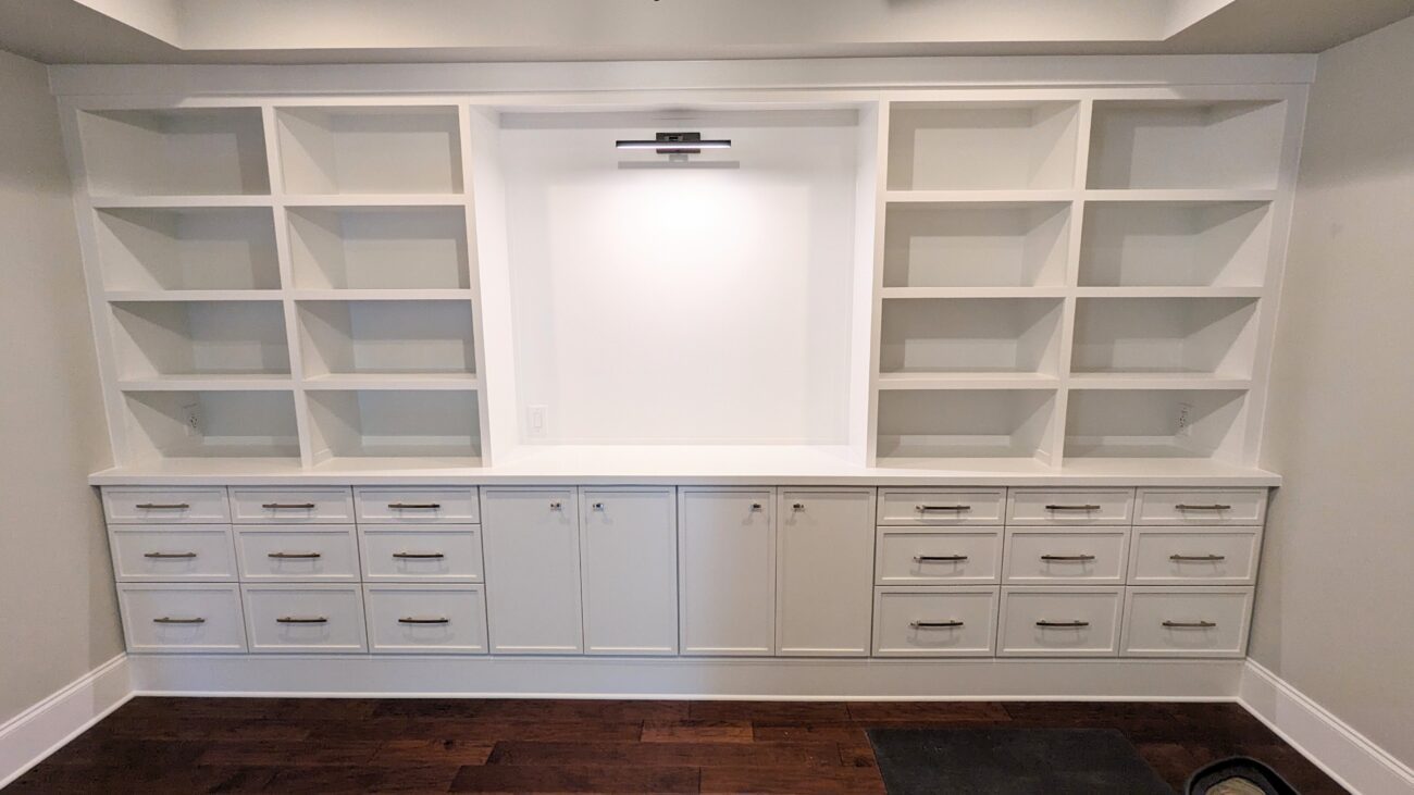 White built-in shelving and cabinetry.