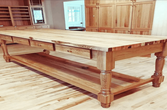 Large wooden kitchen island with drawers.