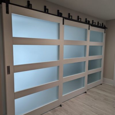 White sliding doors with frosted glass panels.