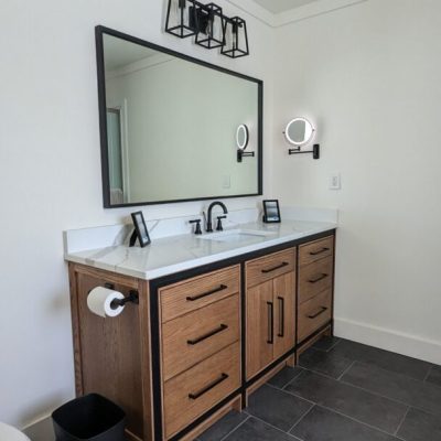 Modern bathroom vanity with black accents.